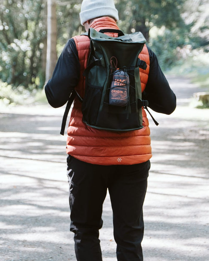 Burnt Orange Coloured Mac In A Sac Mens Synergy Gilet on street background #colour_burnt-orange