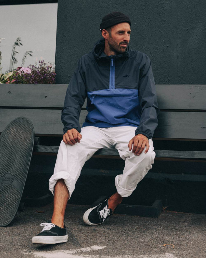 Navy Blue coloured Mac In A Sac Nomad Waterproof Half Zip Jacket on outdoor background #colour_navy-blue