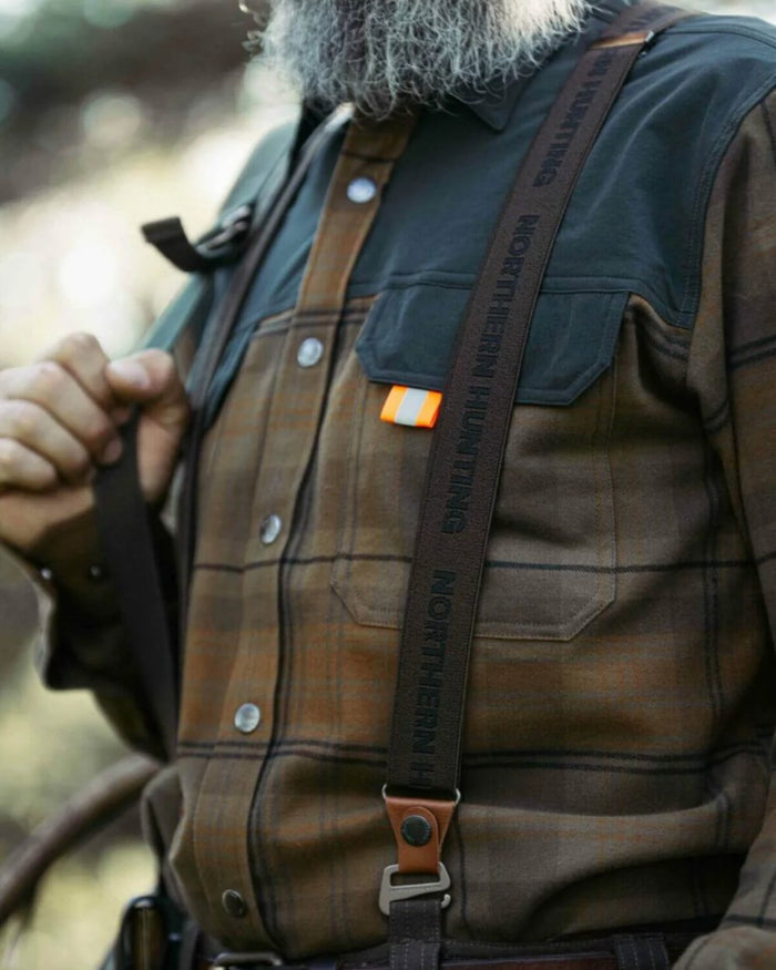 Green coloured Northern Hunting Hjalm Suspenders on forest background #colour_green