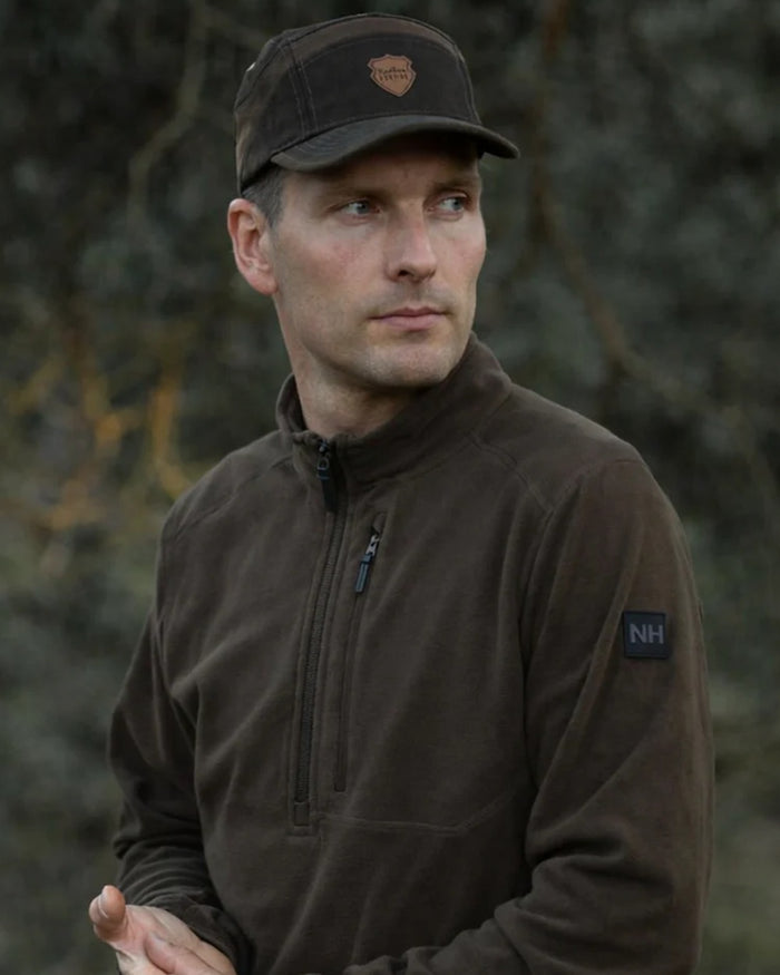 Green coloured Northern Hunting Mens Kettil 1000 Lightweight Fleece on forest background #colour_green