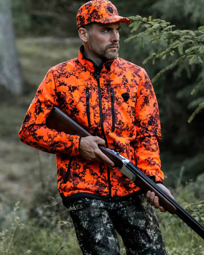 Camo coloured Northern Hunting Mens Skjold Arn G2 Waterproof Hunting Trousers on forest background #colour_camo