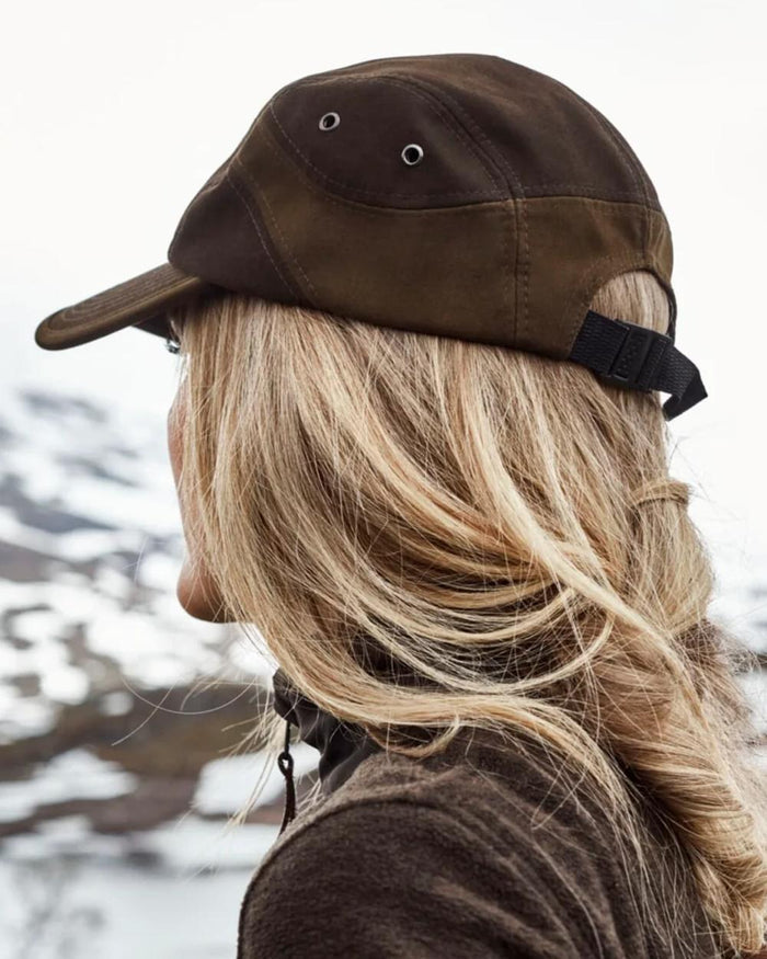 Dark Green coloured Northern Hunting Roald Cap on outdoor background #colour_dark-green