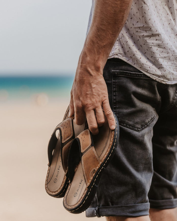 Sand coloured Orca Bay Mens Belize Sandals on sea background #colour_sand