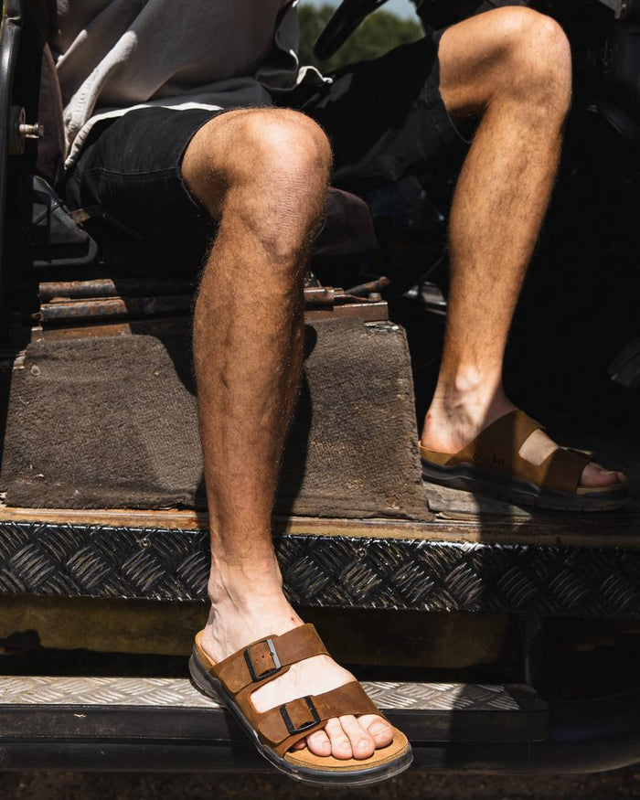 Sand coloured Orca Bay Mens Carbis Sandals on car background #colour_sand