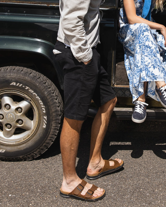 Sand coloured Orca Bay Mens Carbis Sandals on car background #colour_sand