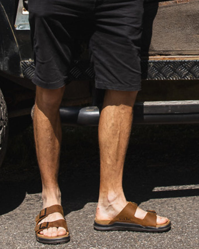 Sand coloured Orca Bay Mens Carbis Sandals on outdoor background #colour_sand