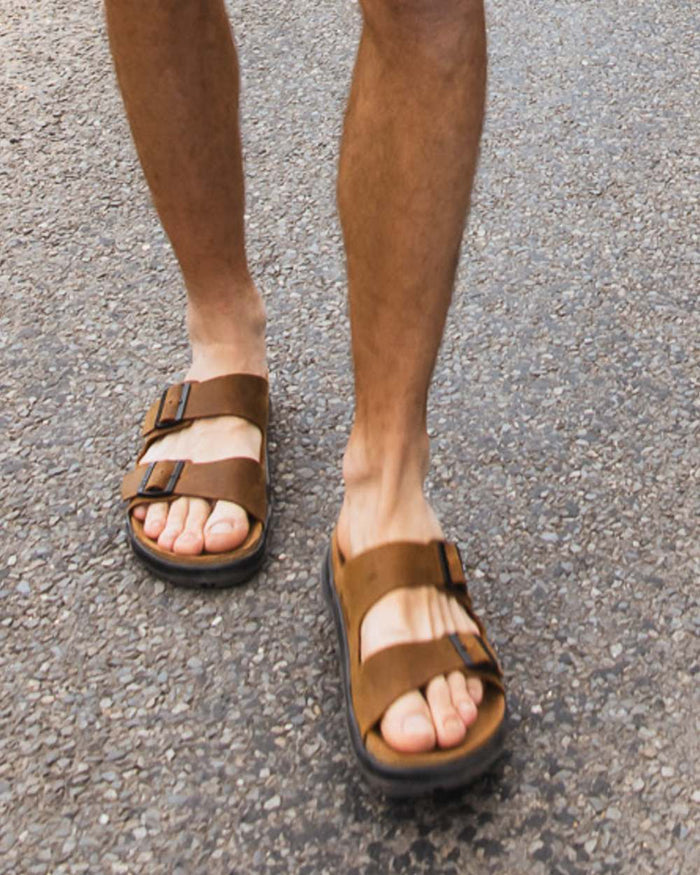 Sand coloured Orca Bay Mens Carbis Sandals on outdoor background #colour_sand