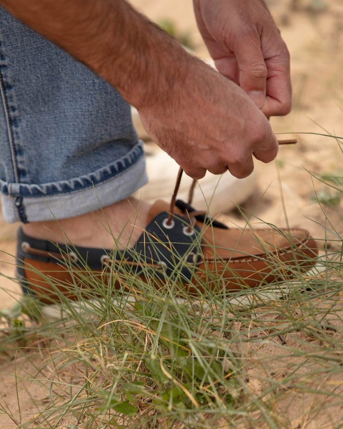 Sand Navy Coloured Orca Bay Mens Clovelly Deck Shoes on sand background #colour_sand-navy