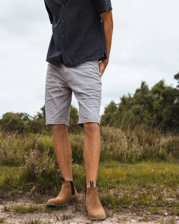 Sand coloured Orca Bay Mens Henley Shoes on grassy background #colour_sand