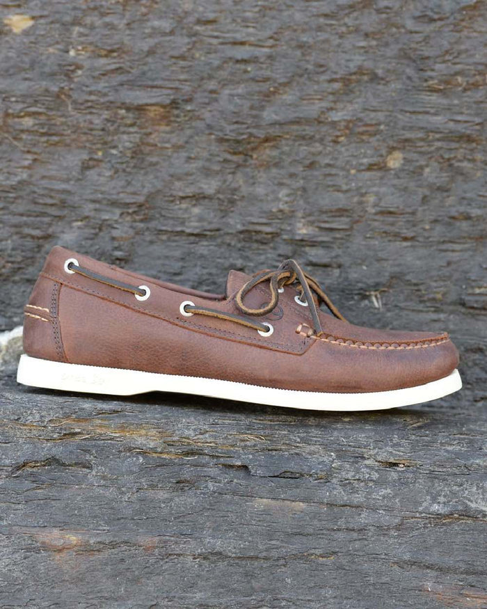Russet Coloured Orca Bay Mens Maine Deck Shoes on stone background #colour_russet