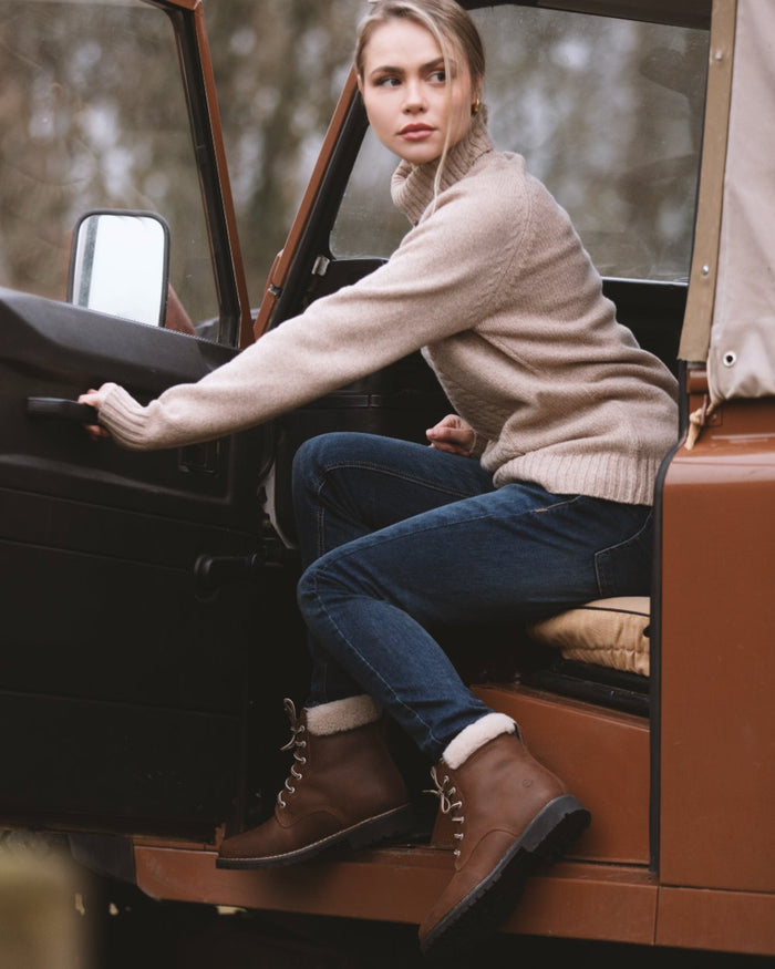 Brown coloured Orca Bay Womens Real Sheepskin Lining Pennine Boots on car background #colour_brown