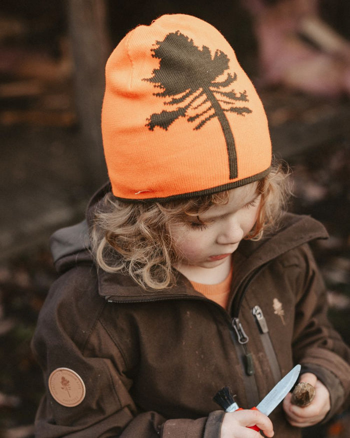 Orange Green coloured Pinewood Childrens Tree Hat on forest background #colour_orange-green