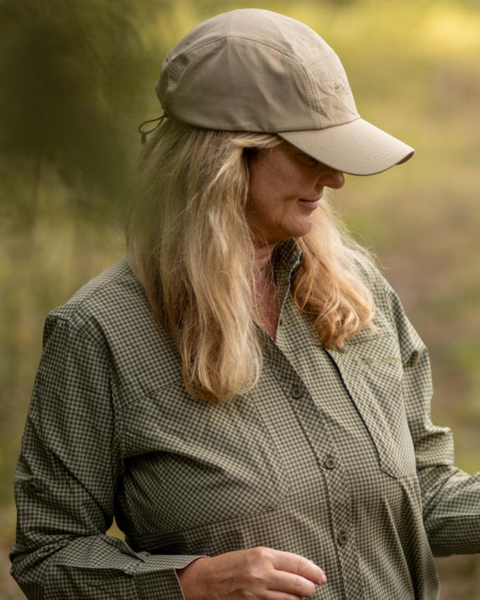 Light Khaki coloured Pinewood Insectsafe Cap on forest background #colour_light-khaki