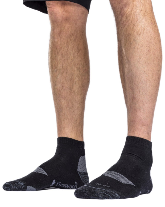 Black coloured Pinewood Insectsafe Cotton Mid Socks on white background #colour_black