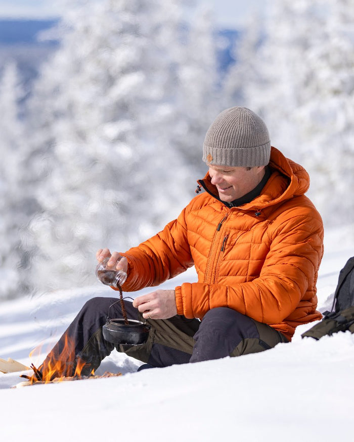 Burned Orange Coloured Pinewood Mens Abisko Insulation Jacket on snow background #colour_burned-orange
