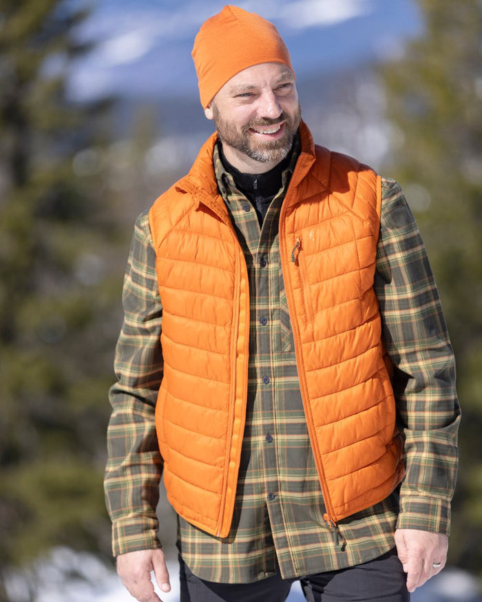Burned Orange Coloured Pinewood Mens Abisko Insulation Vest on snow background #colour_burned-orange