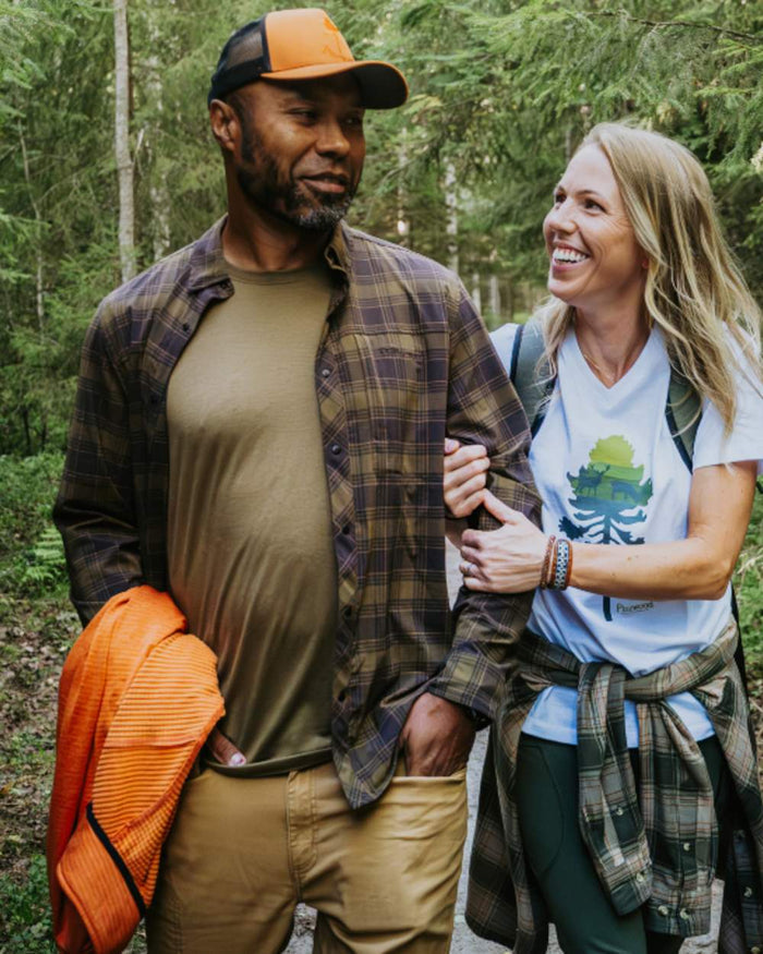 Dark Olive Dark Sandstone coloured Pinewood Mens Abisko Trekking InsectSafe Long Sleeve Shirt on forest background #colour_dark-olive-dark-sandstone