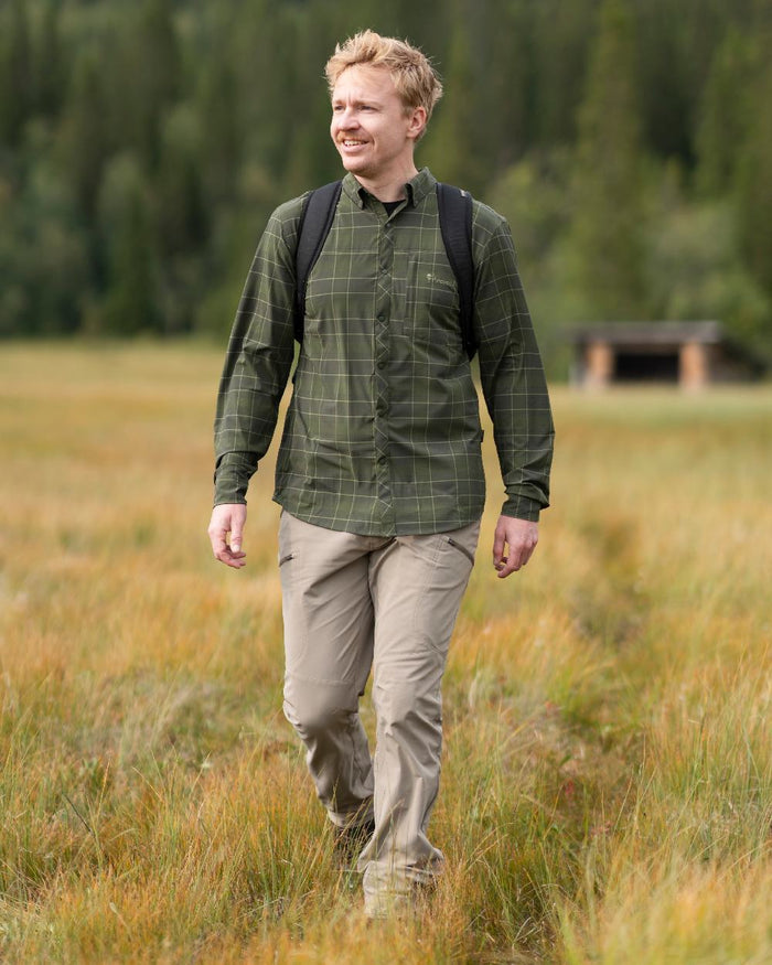 Moss Green Coloured Pinewood Mens Abisko Trekking Long Sleeve Shirt on outdoor background #colour_moss-green