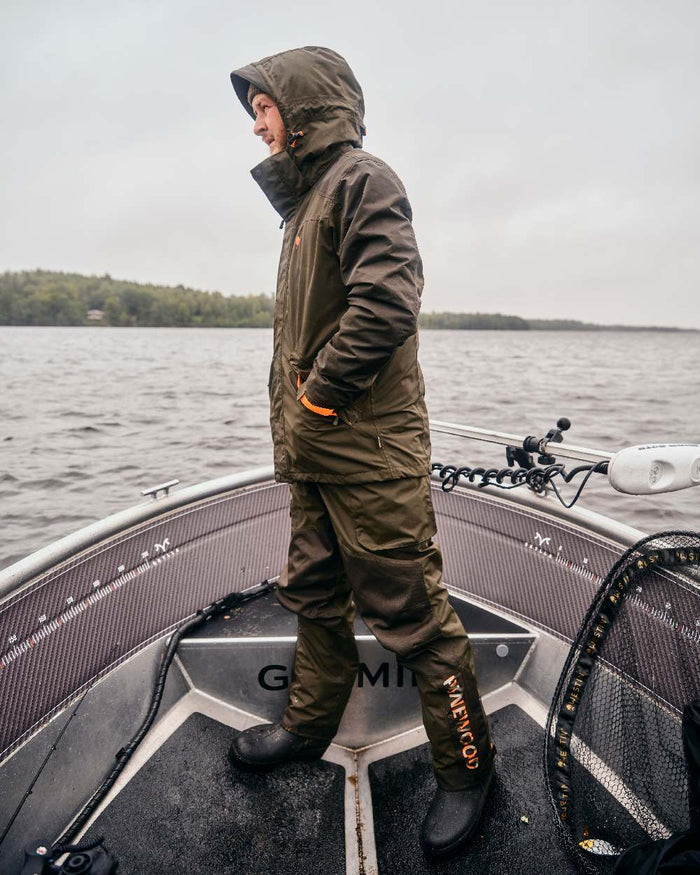 Green Dark Green Coloured Pinewood Mens Bolmen Fishing Bib Trousers on outdoor background #colour_green-dark-green