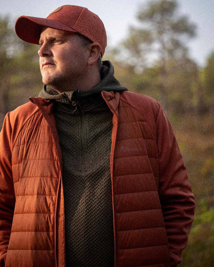 Dark Green Mel Coloured Pinewood Mens Everyday Travel Hoodie on outdoor background #colour_dark-green-mel