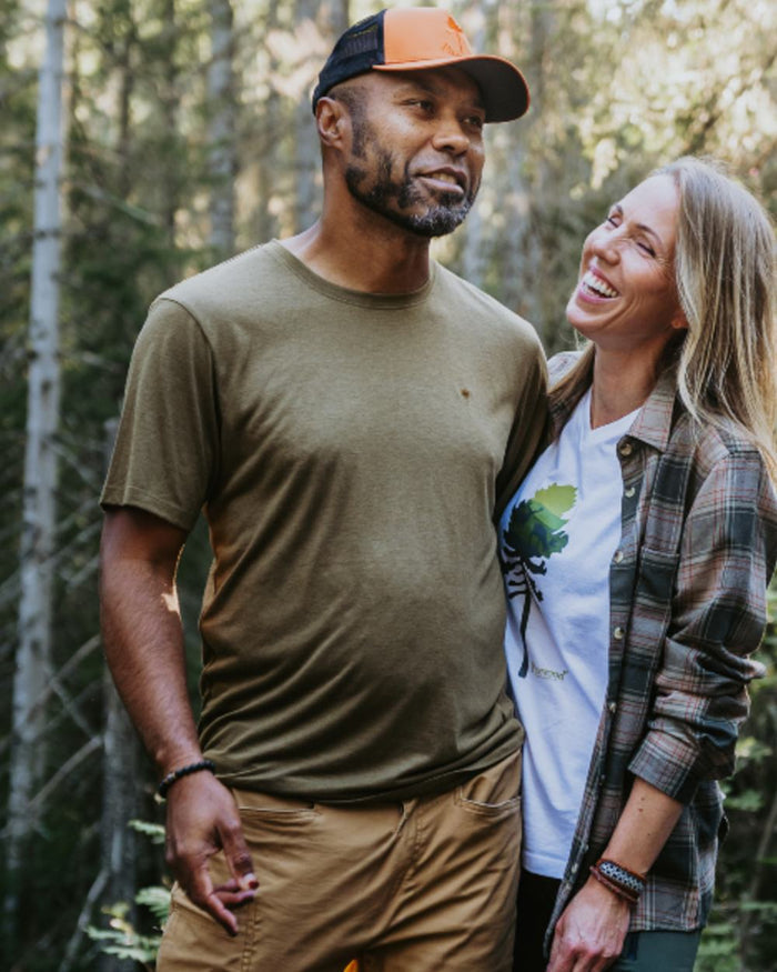 Olive Green coloured Pinewood Mens Finnveden Forest T-Shirt on forest background #colour_olive-green