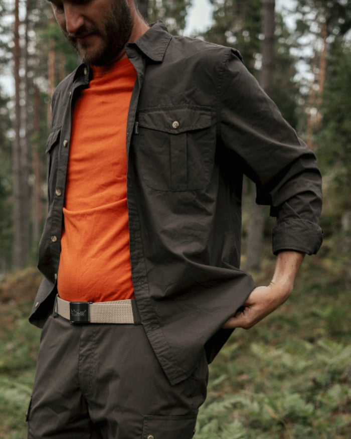 Dark Olive coloured Pinewood Mens InsectSafe Poplin Long Sleeve Shirt on forest background #colour_dark-olive