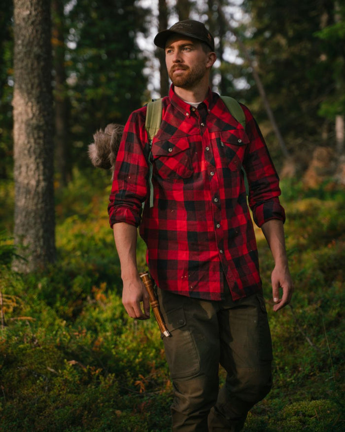 Red Black coloured Pinewood Mens Lumbo Shirt on forest background #colour_red-black