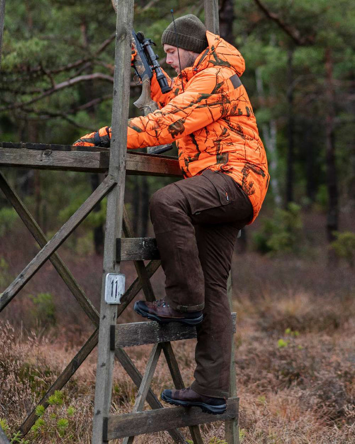 Suede Brown Coloured Pinewood Mens Smaland Abisko 2.0 Hunting Trousers on outdoor background #colour_suede-brown