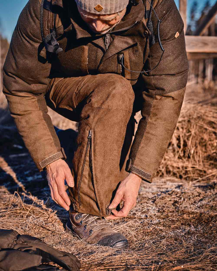 Suede Brown Coloured Pinewood Mens Smaland Abisko 2.0 Hunting Trousers on outdoor background #colour_suede-brown