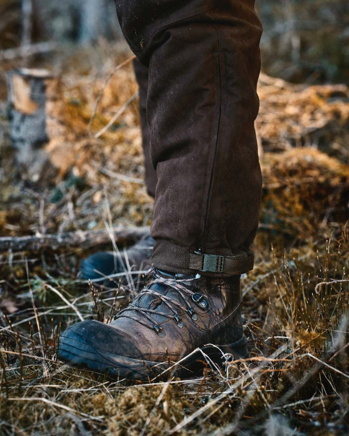 Suede Brown Coloured Pinewood Mens Smaland Abisko 2.0 Hunting Trousers on outdoor background #colour_suede-brown
