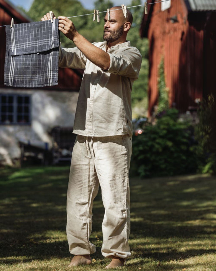 Linen Beige coloured Pinewood Mens Varnamo InsectSafe Hemp Mix Trousers on outdoor background #colour_linen-beige