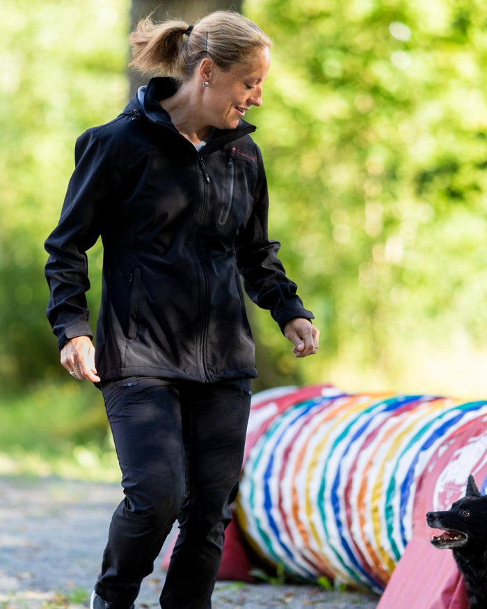 Black Coloured Pinewood Womens Abisko Brenton Trousers on outdoor background #colour_black