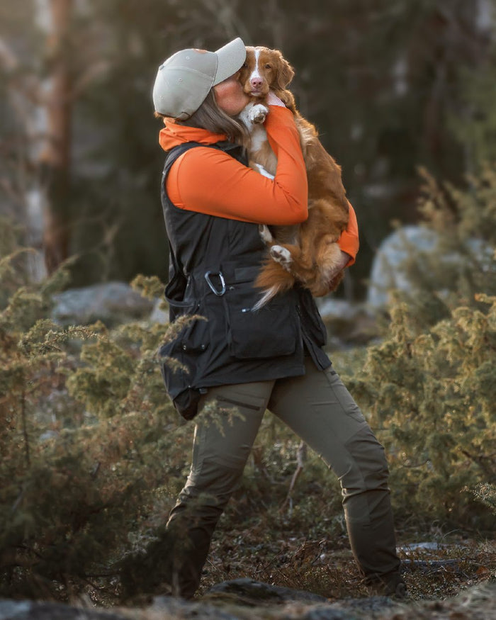 Black Coloured Pinewood Womens Dog Sports Trainer Vest on forest background #colour_black