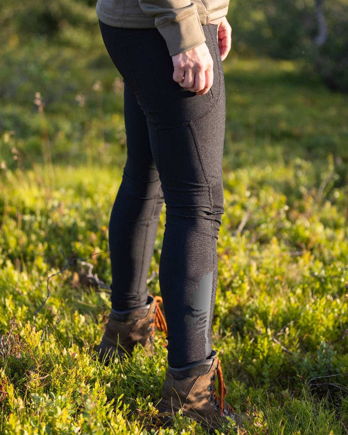 Black Coloured Pinewood Womens Finnveden Active Tights on outdoor background #colour_black