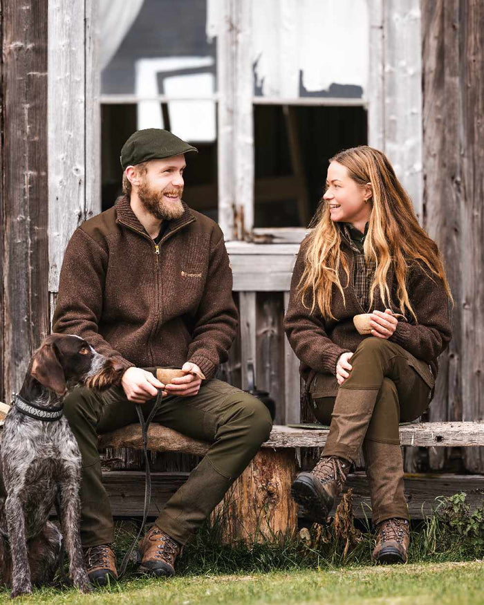 Suede Brown Dark Olive Coloured Pinewood Womens Furudal Caribou Hunt Trousers on outdoor background #colour_suede-brown-dark-olive