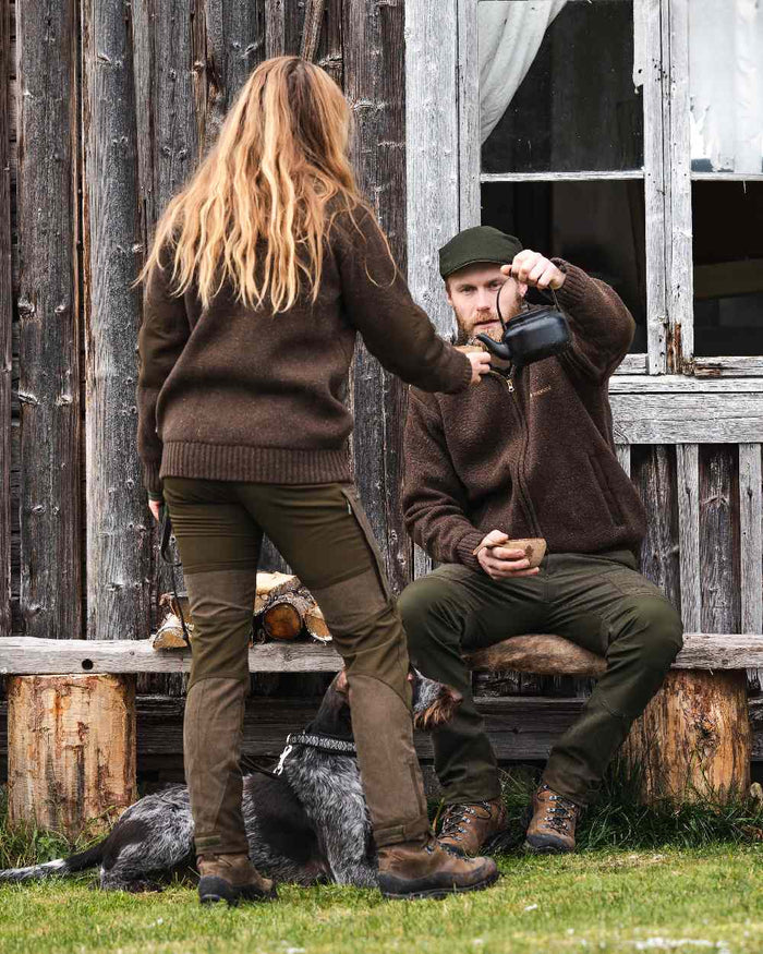 Suede Brown Dark Olive Coloured Pinewood Womens Furudal Caribou Hunt Trousers on outdoor background #colour_suede-brown-dark-olive