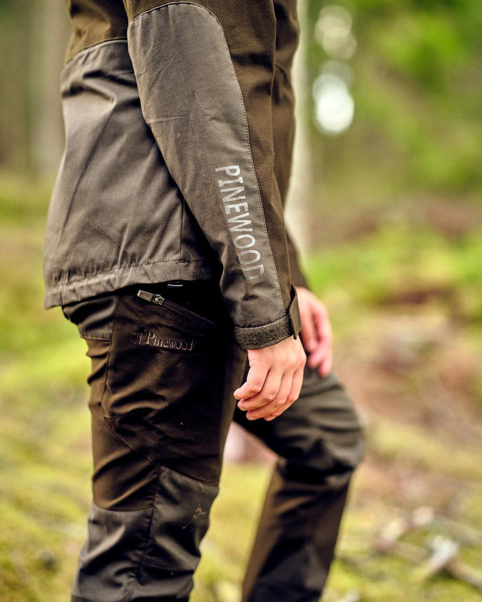 Mossgreen Dark Mossgreen Pinewood Womens Furudal Tracking Trousers on forest background #colour_mossgreen-dark-mossgreen