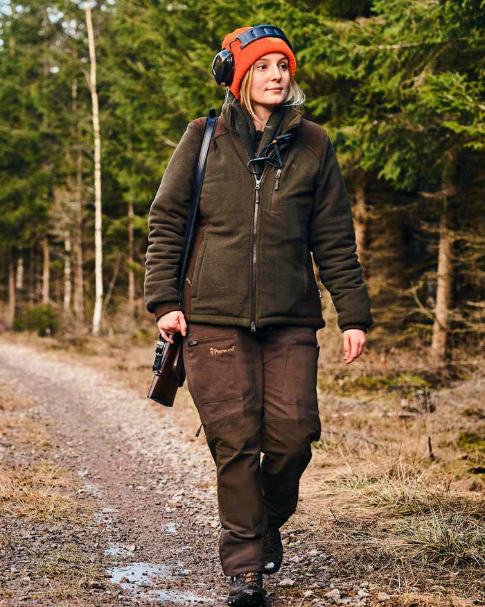Green Suede Brown Coloured Pinewood Womens Harriette Padded Fleece Jacket on forest background #colour_green-suede-brown