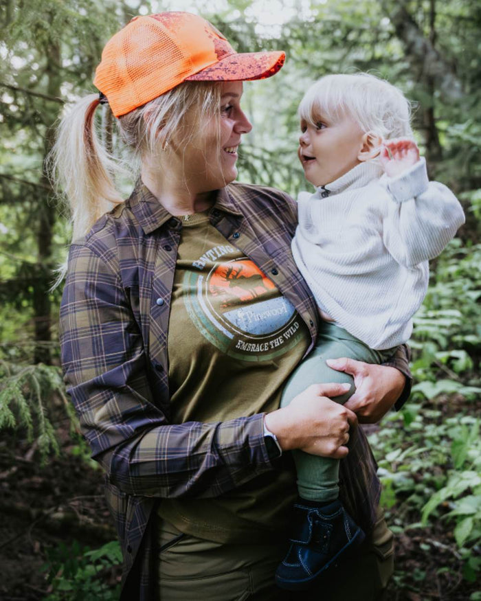 Hunter Olive coloured Pinewood Womens Moose T-Shirt on forest background #colour_hunter-olive