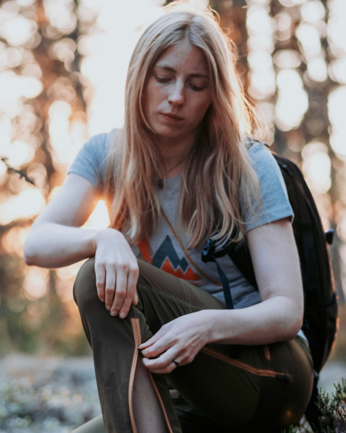 Light Grey Melange coloured Pinewood Womens Outdoor Trekker T-Shirt on forest background #colour_light-grey-melange