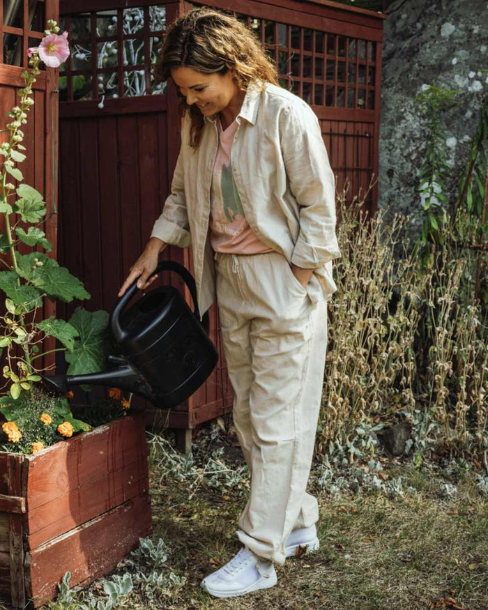 Linen Beige coloured Pinewood Womens Varnamo InsectSafe Hemp Mix Trousers on tree background #colour_linen-beige