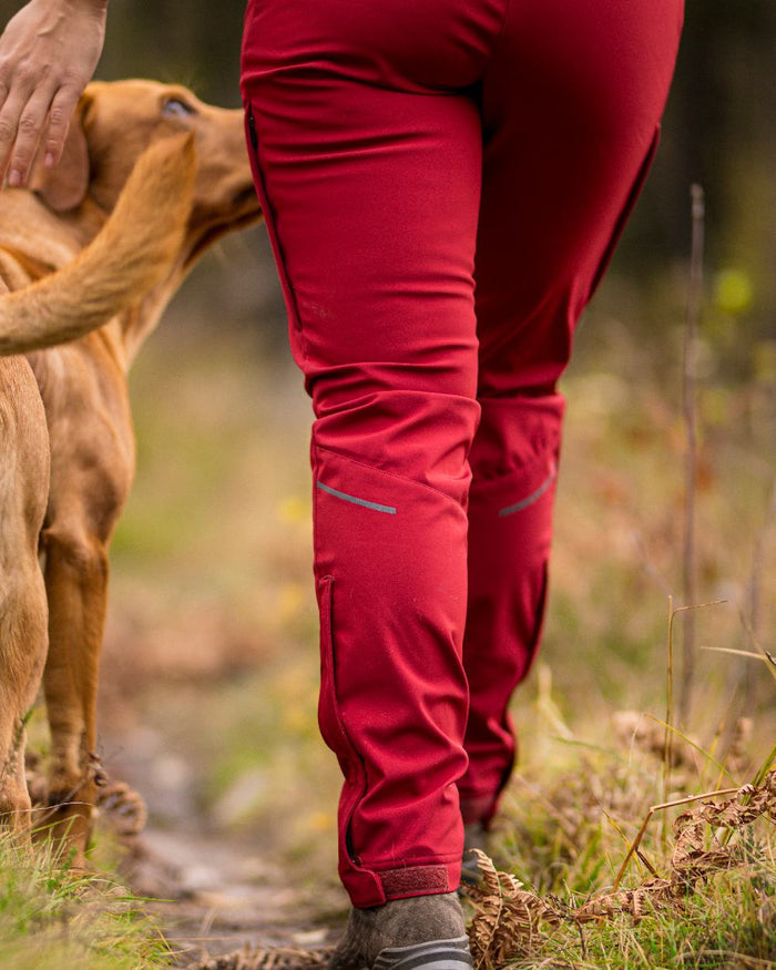 Dark Tomato Coloured Pinewood Womens Wilda Stretch Shell Trousers on outdoor background #colour_dark-tomato