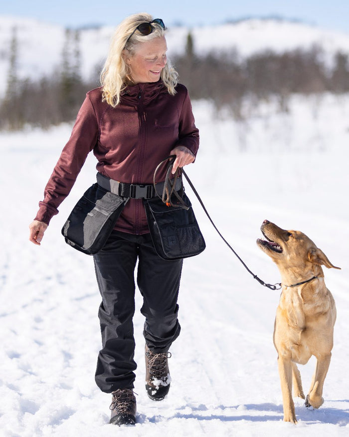 Black Coloured Pinewood Womens Wilda Stretch Shell Trousers on outdoor background #colour_black