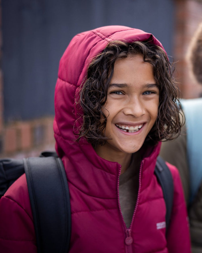 Dark Pimento Coloured Regatta Childrens Halkner Quilted Jacket on outdoor background #colour_dark-pimento