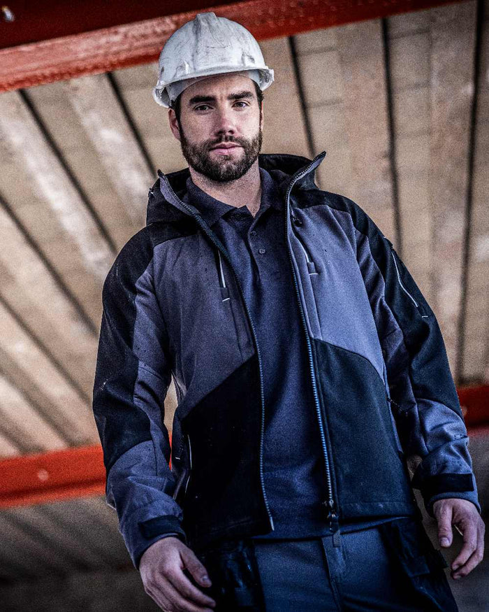 Slate Grey Black coloured Regatta Mens 4Tex Stretch 3 Layer Softshell Jacket on blurry background #colour_slate-grey-black