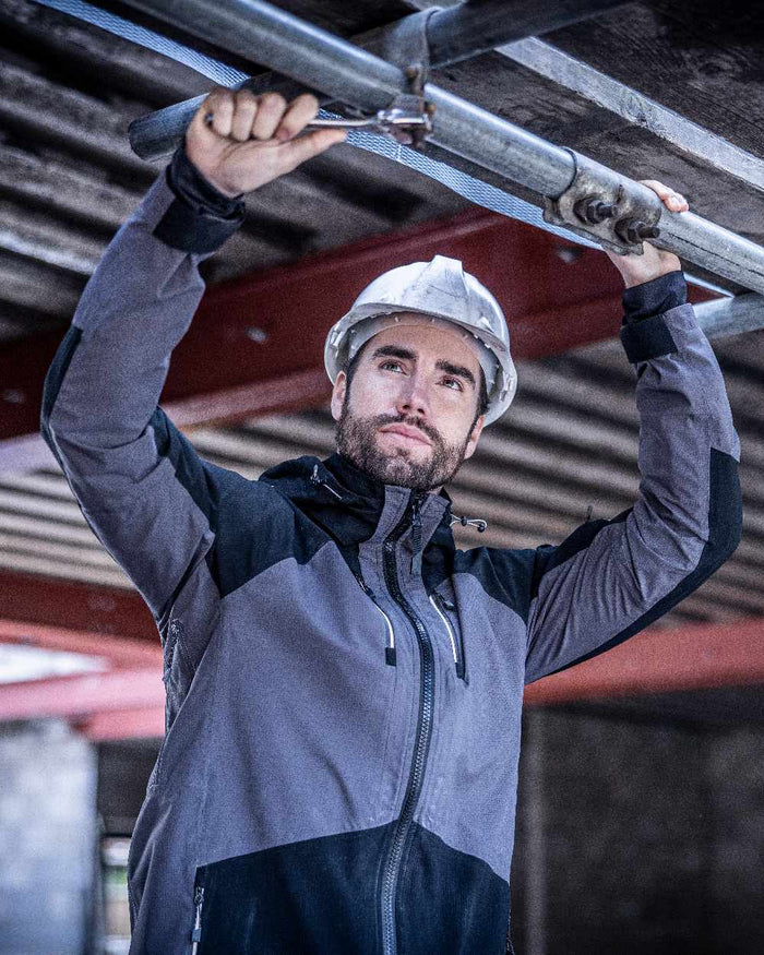 Slate Grey Black coloured Regatta Mens 4Tex Stretch Waterproof Shell Jacket on blurry background #colour_slate-grey-black