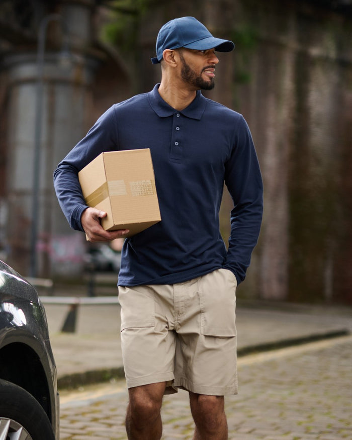 Navy coloured Regatta Professional Mens 65/35 Long Sleeves Polo Top on outdoor background #colour_navy