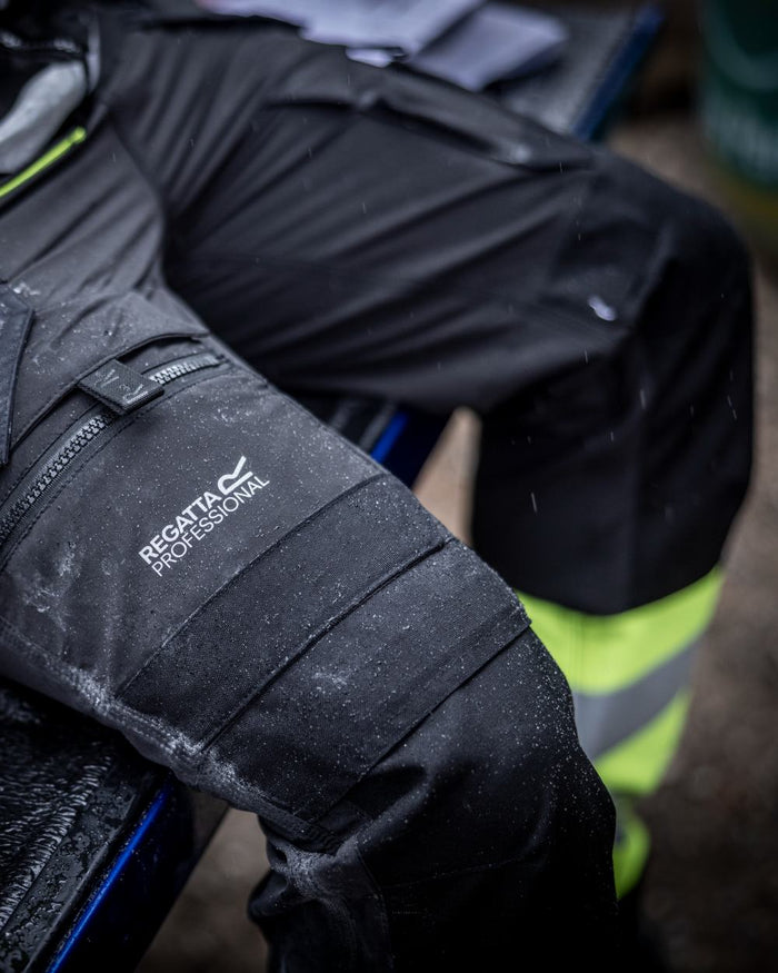 Black Yellow Coloured Regatta Mens Hi-Vis X-Pro Stretch Holster Trousers Class 1 on Blurry Background
#colour_black-yellow