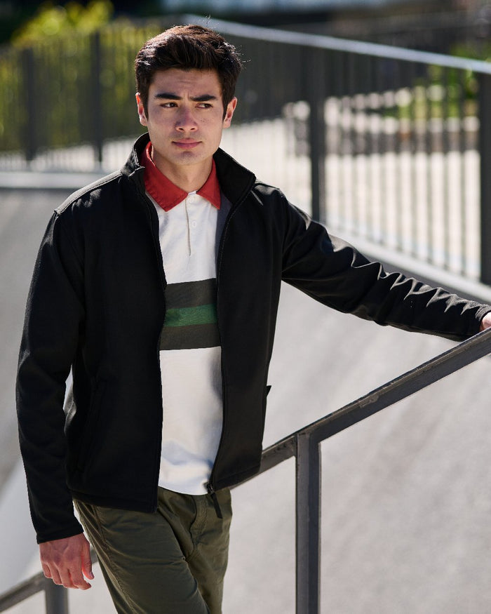 Black coloured Regatta Mens Reid Softshell Jacket on blurry background #colour_black