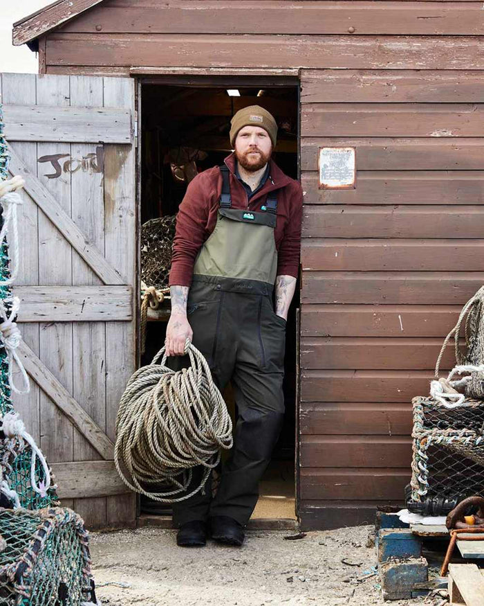 Deep Forest coloured Ridgeline Mens Agri Pro Bib & Brace on dock background #colour_deep-forest
